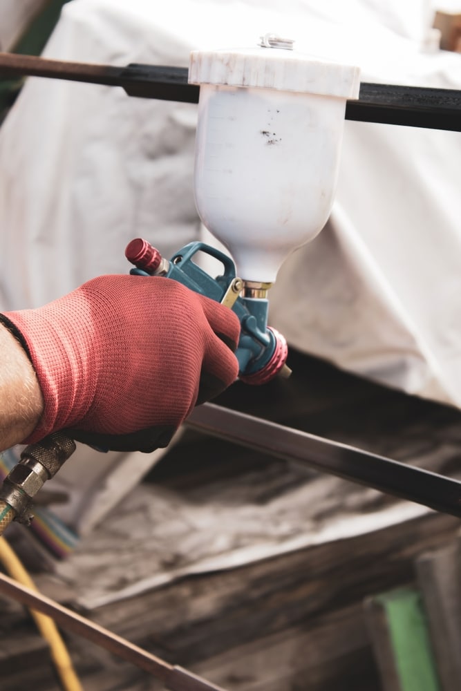 Latex spuiten Rotterdam met spuitpistool voor strak schilderwerk